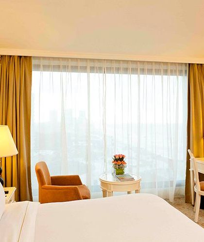 Luxury room with wide window views at The Kingsbury Hotel
