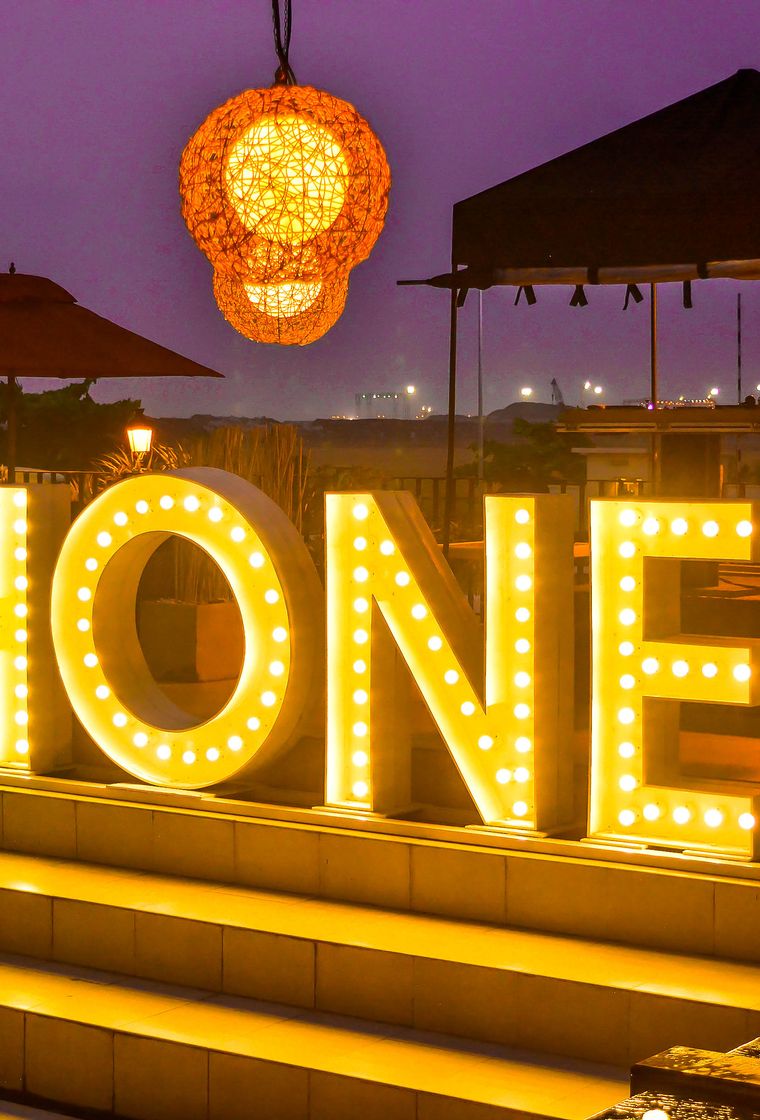 Marquee Lights setup spelling 'HONEY' at the Honeybeach club at the Kingsbury