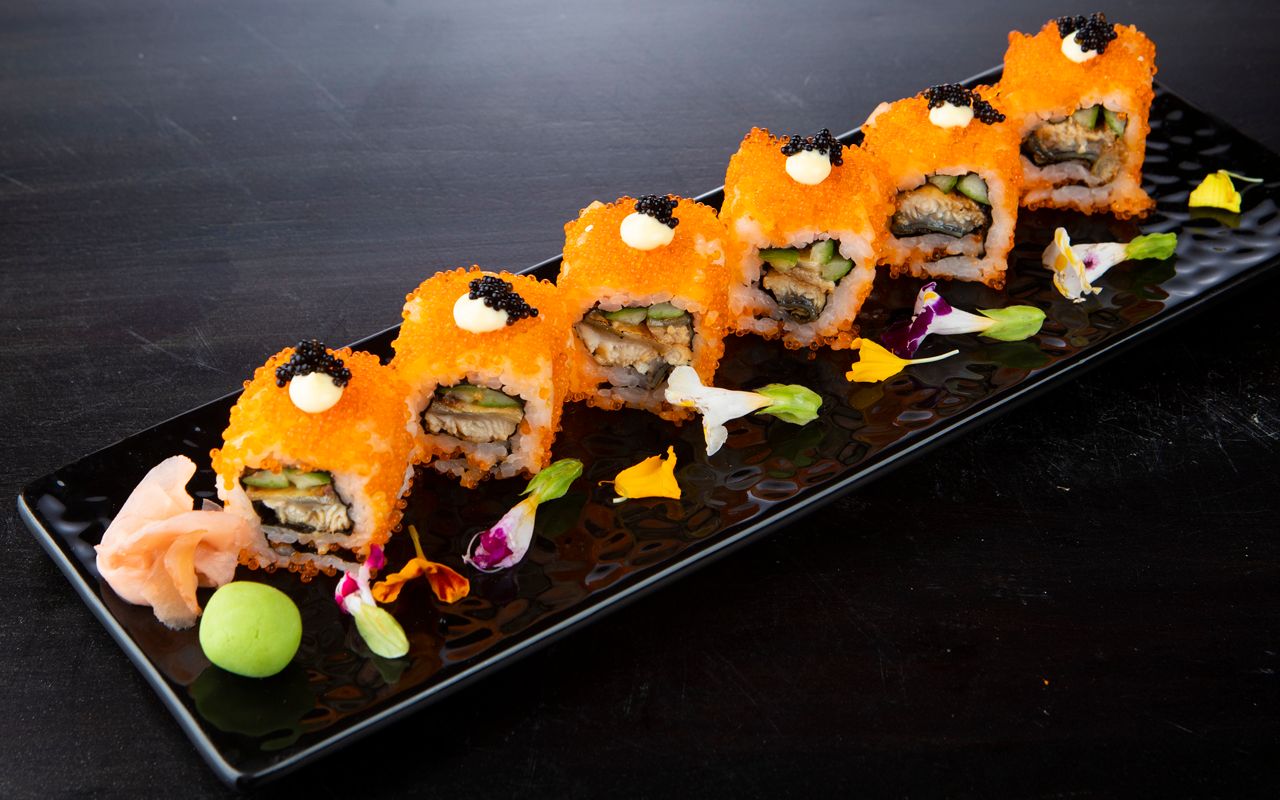 Avacado sushi rolls displayed on a black sushi plate at The Kingsbury Hotel