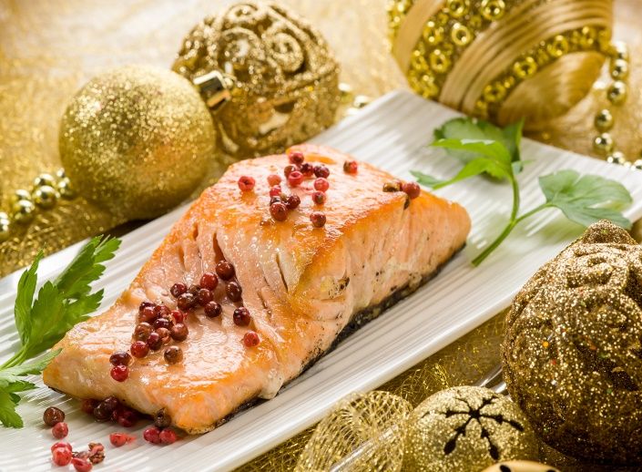 Roasted salmon fish displayed with Chrismas ornaments 