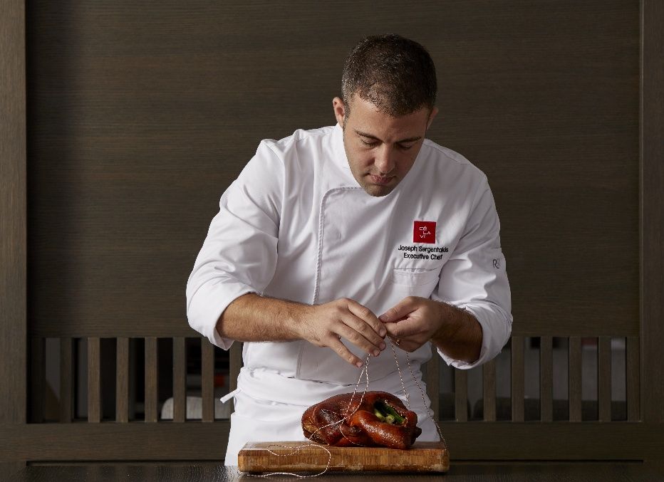 Executive chef dressing a peaking duck dish at The Kingsbury Hotel