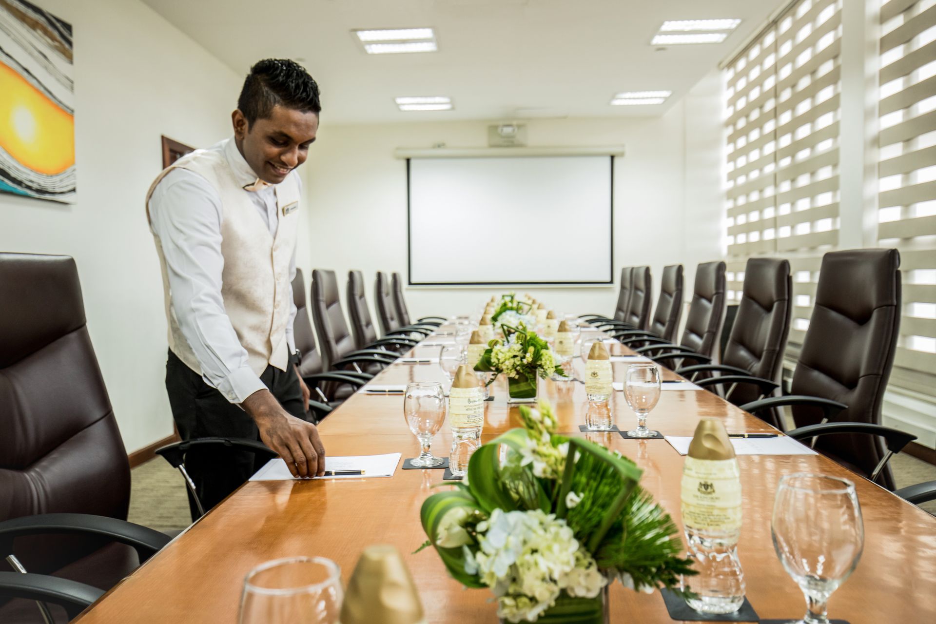 Kingsbury employee preparing the Knightsbridge meeting room