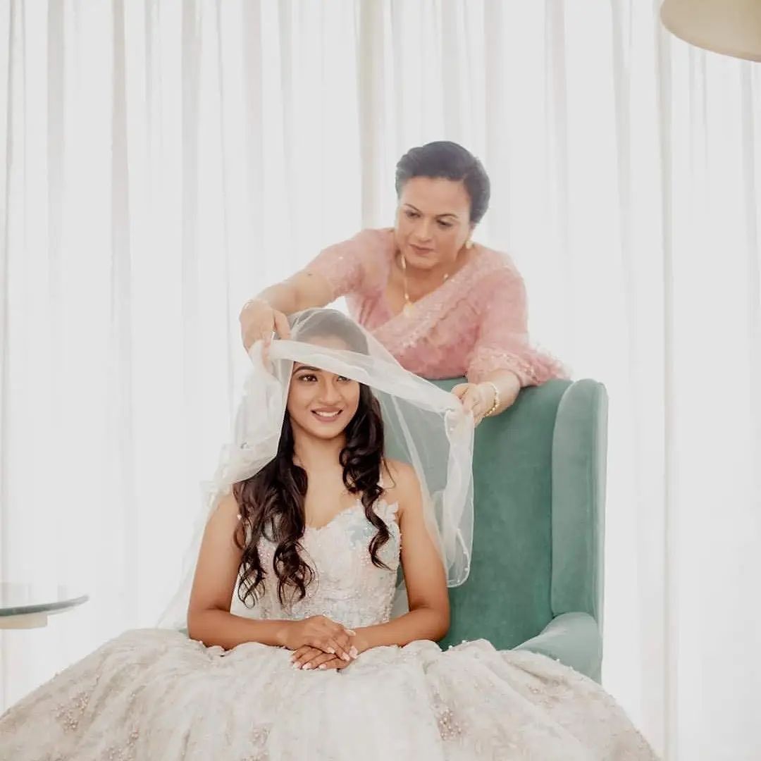 Brides mother preparing her for the wedding at The Kingsbury Hotel 
