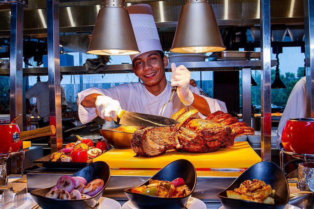 Chef cutting a steak at The Kingsbury Hotel