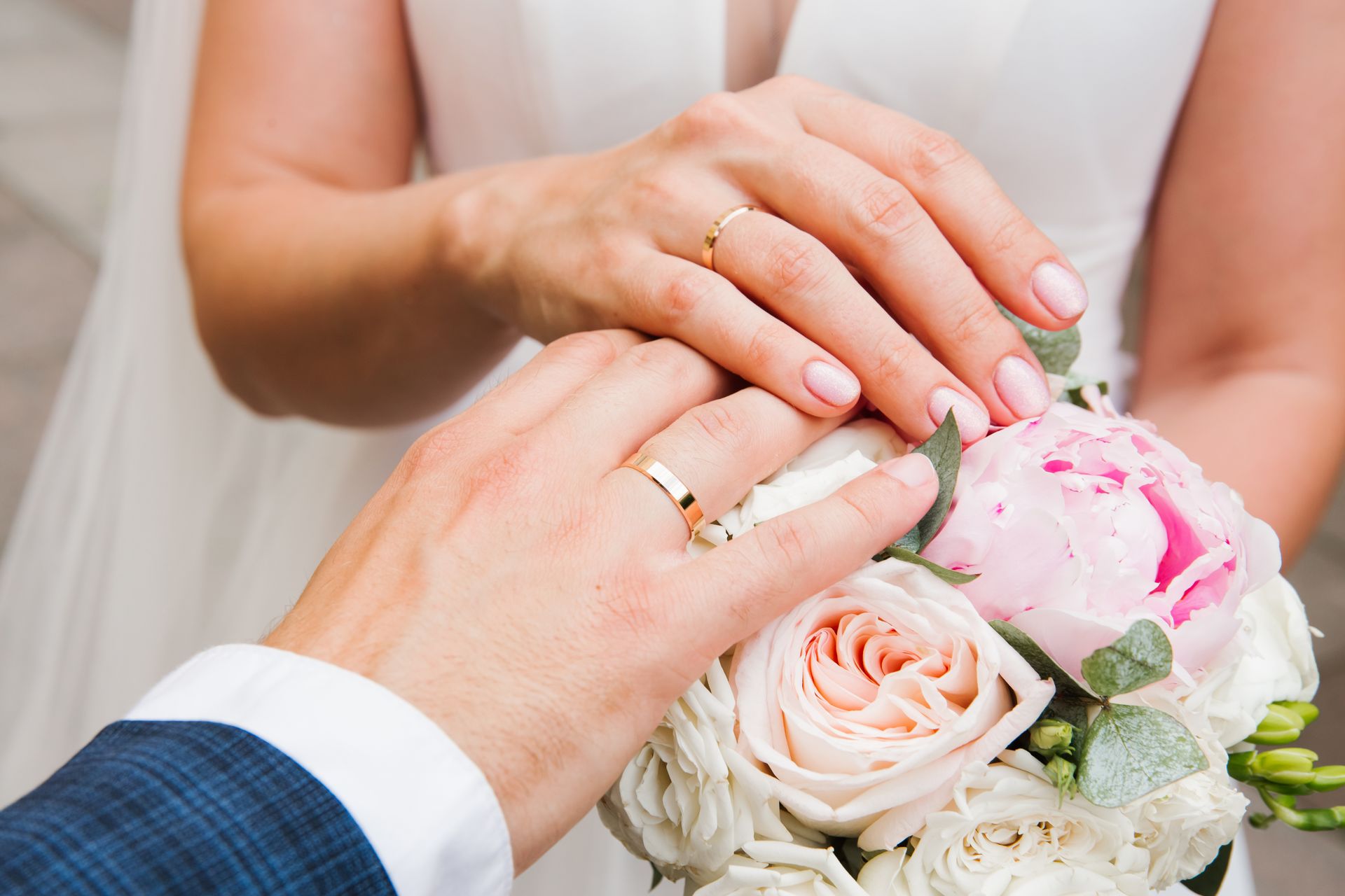 Newly married couples hands with wedding bands at The Kingsbury Hotel