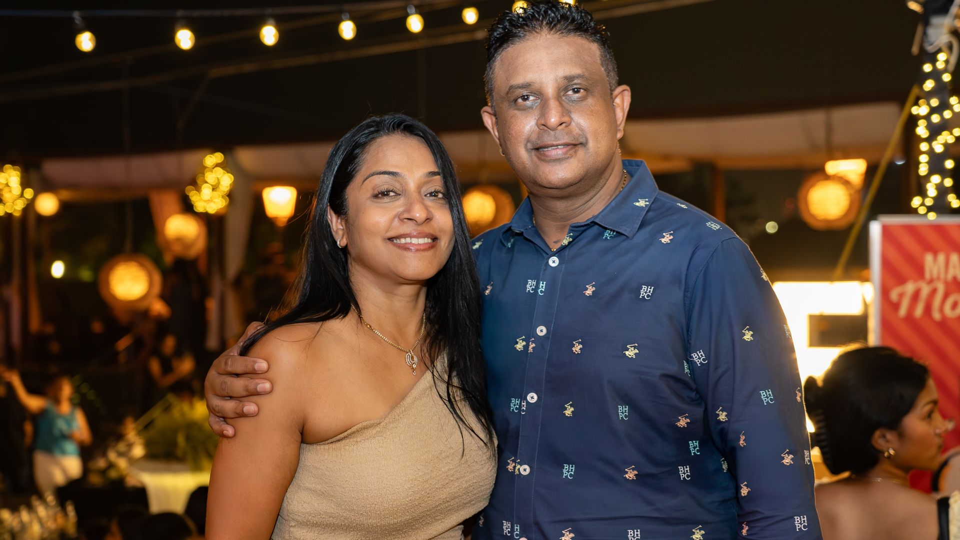 A smiling couple posing together during New Year celebration