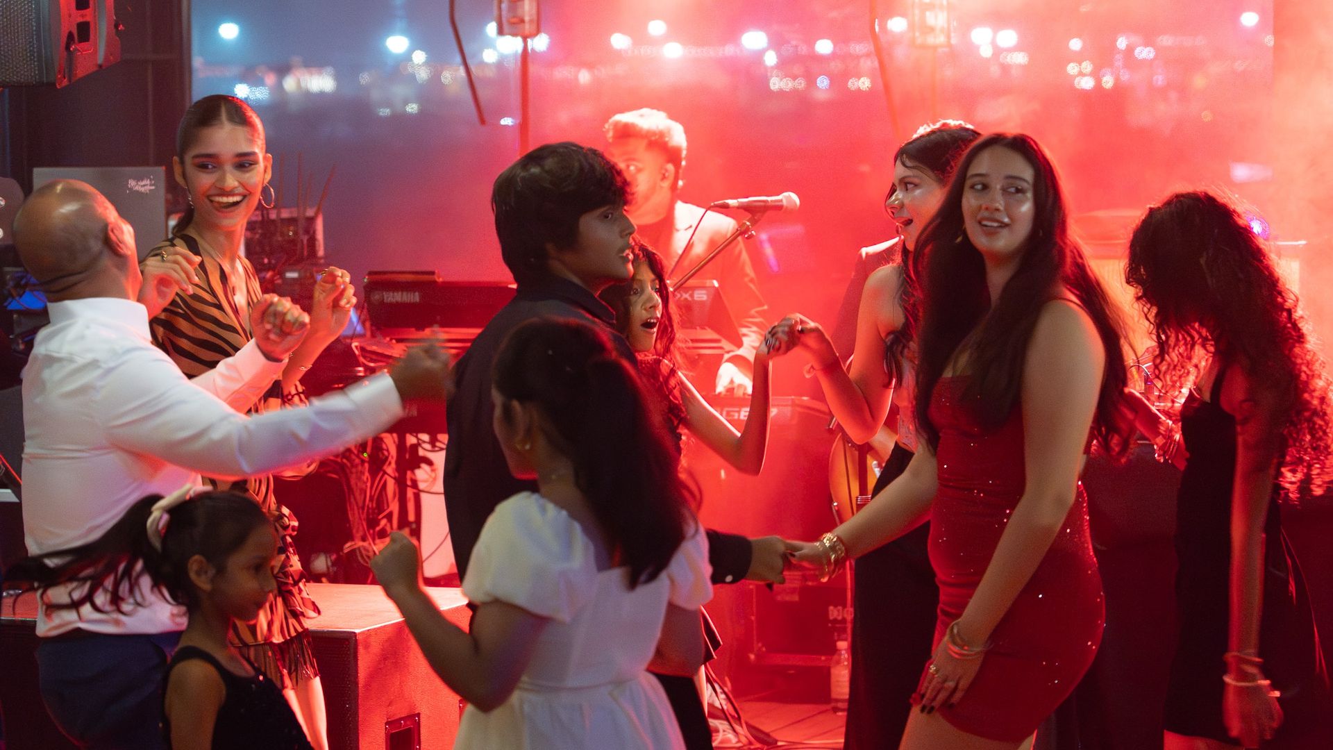 A group of young people dancing at a party