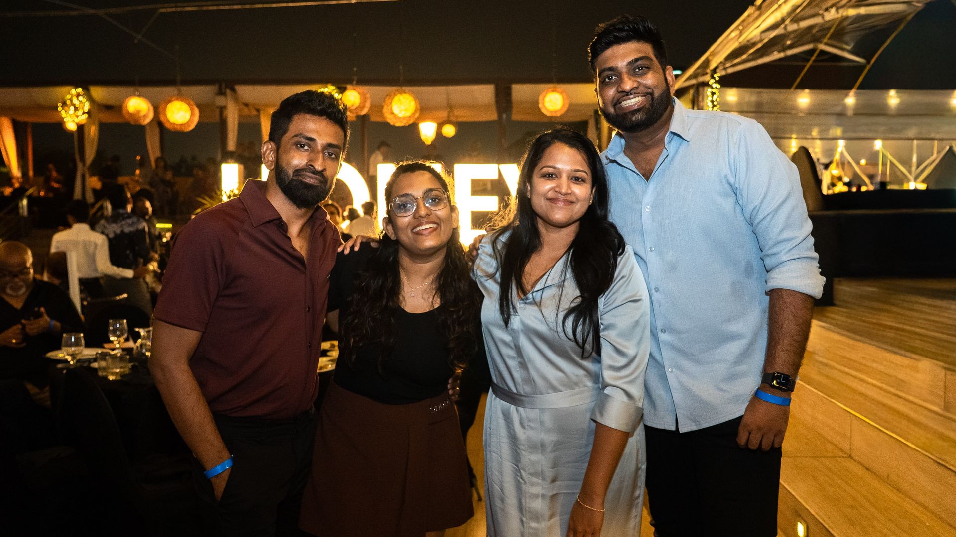 Friends celebrating New Year in the Honey Beach Club at The Kingsbury Colombo