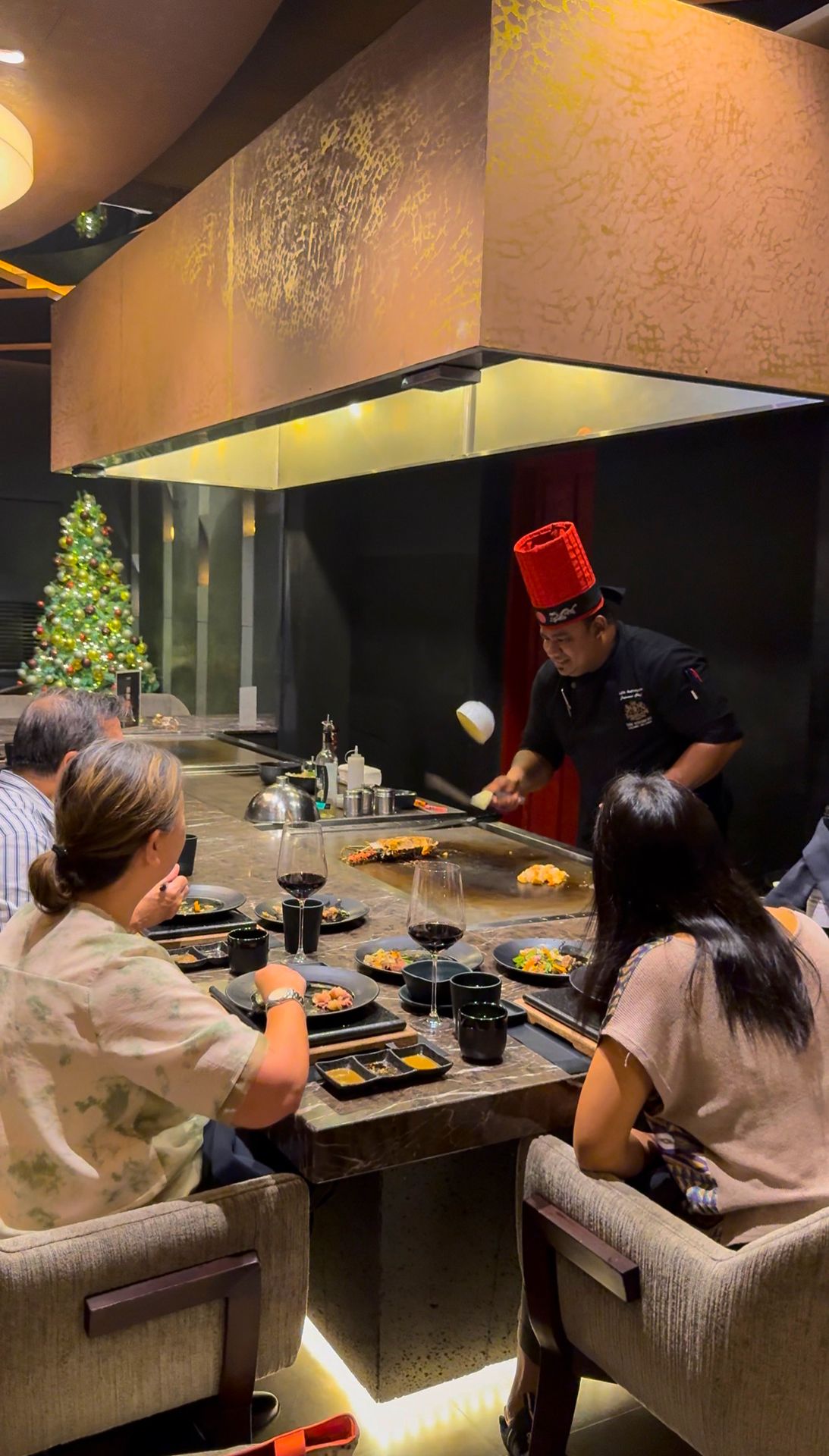 A family enjoying a meal at the Tenku Restaurant at The Kingsbury Colombo